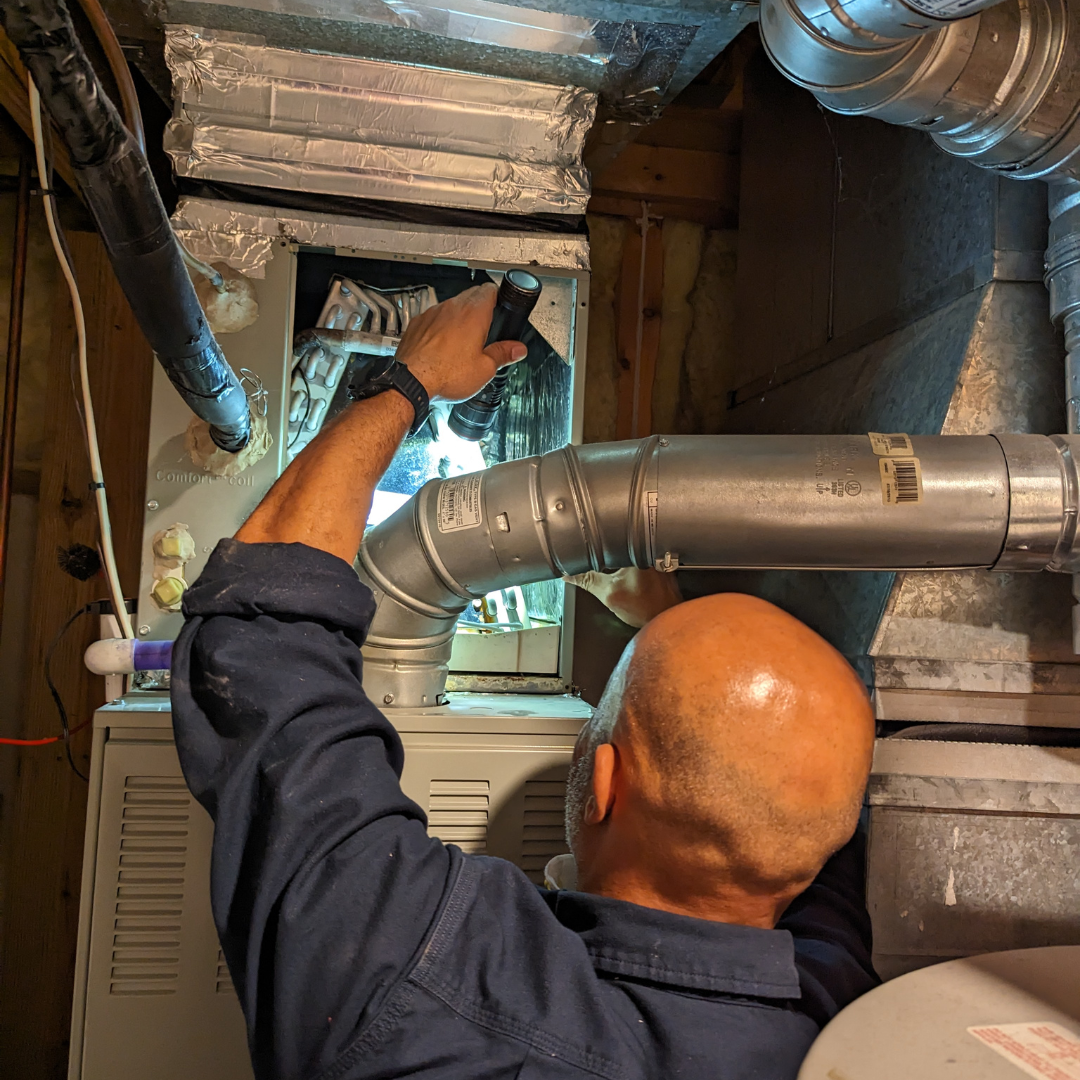 Professional inspector examining HVAC systems during detailed commercial inspection