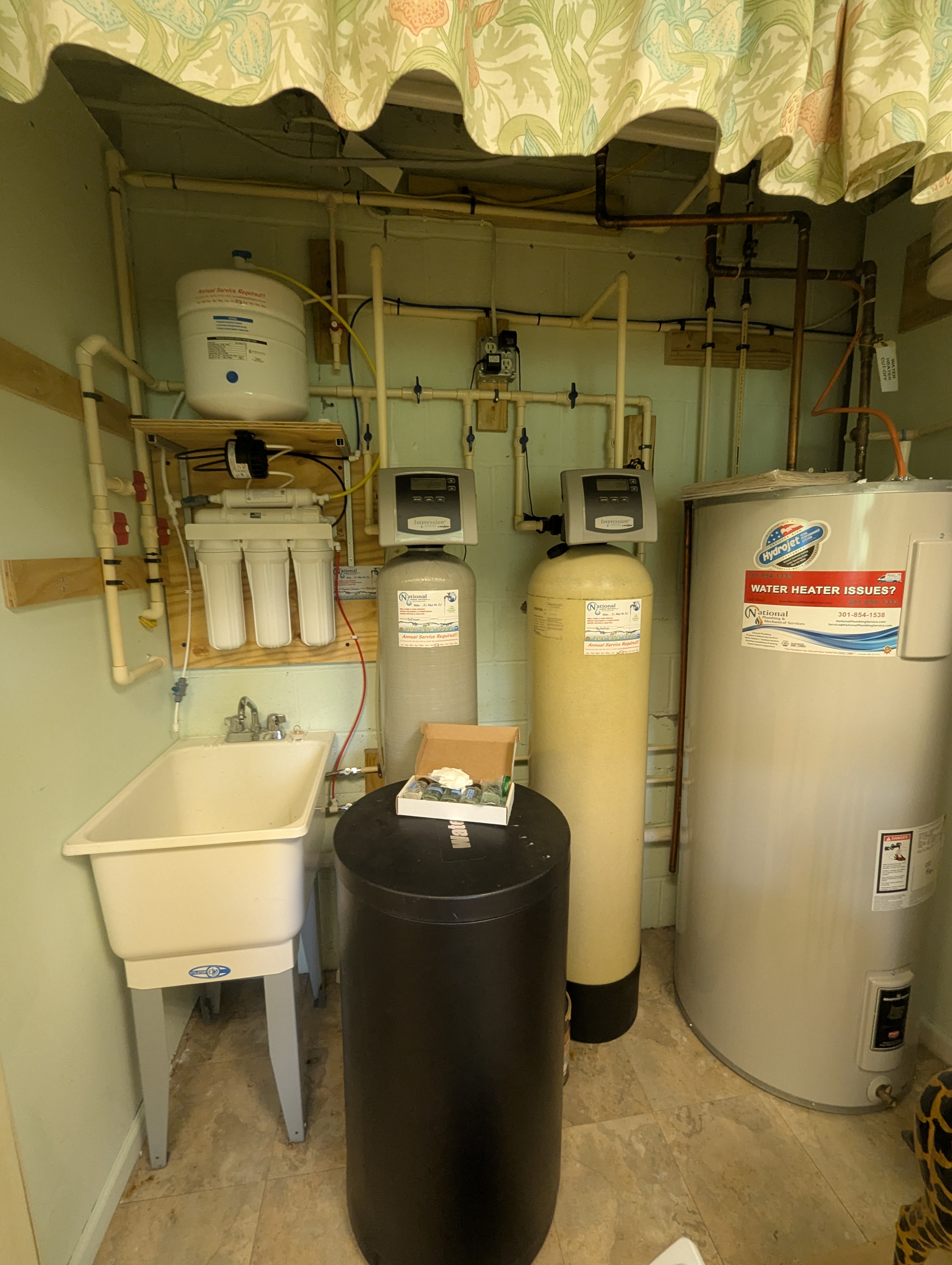 Complete water treatment system with RO, softener, and storage tank